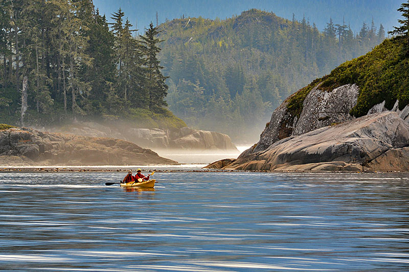 Kayakers paddling the coastal wilderness: Orca Dreams offers kayaking, whale watching and luxury camping on Compton Island, Blackney Pass, British Columbia